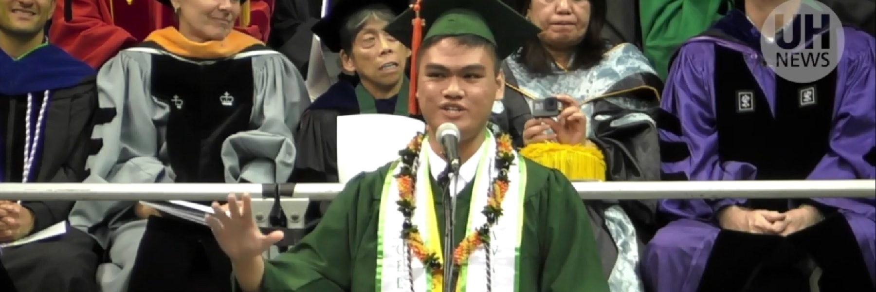 Graduate Addressing A Crowd.