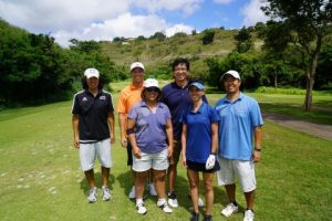 Golfers posing for a photo.