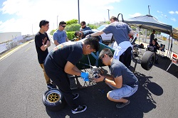 Students working on a Formula car