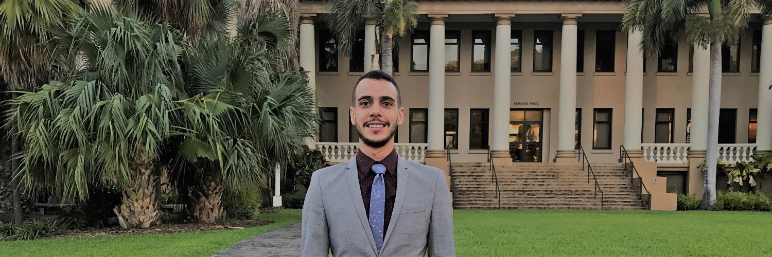 Student Standing In Front Of Hawaiʻi Hall
