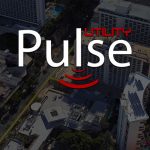 Utility Pulse logo over darkened aerial image of Waikiki