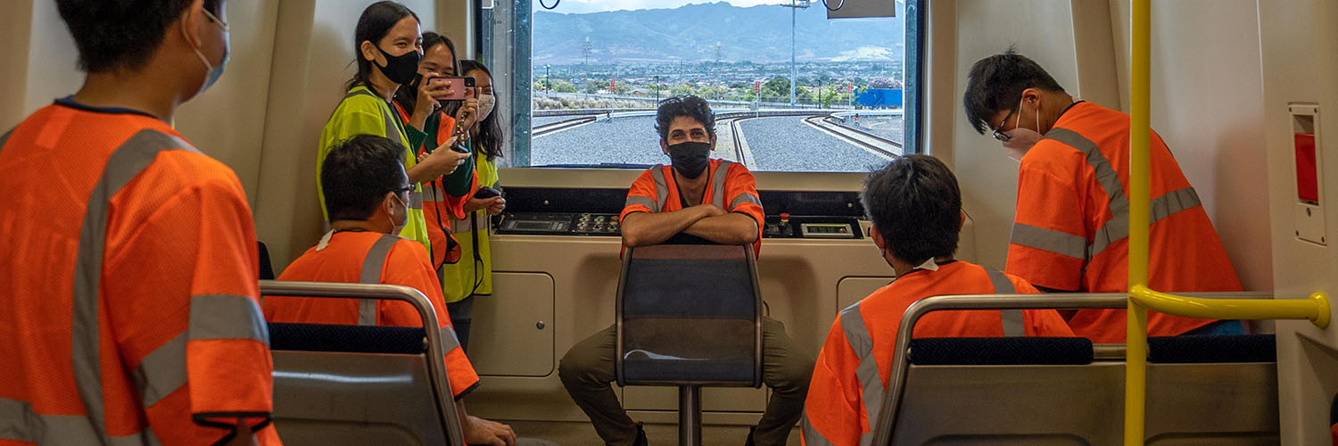 Students Holding A Meeting In A Rail Car.