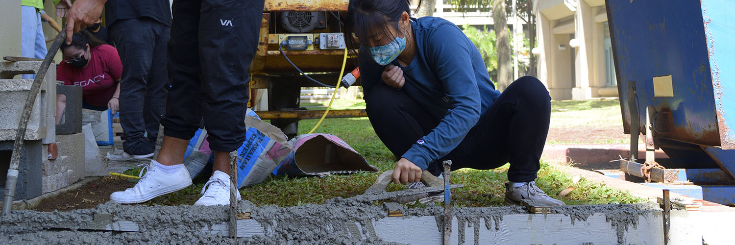 Woman Smoothing Out Wet Concrete