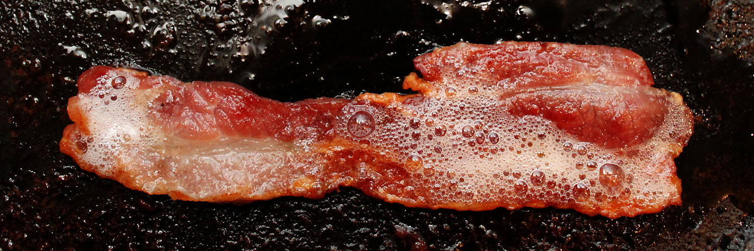 Bacon Sizzling In A Pan