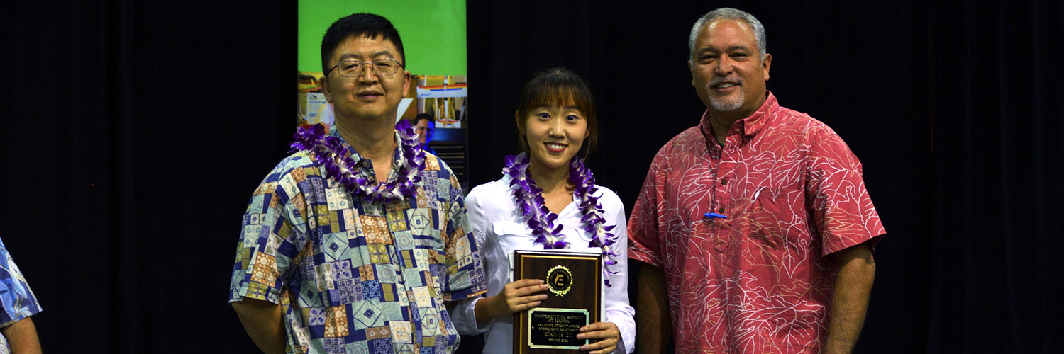 Outstanding Student Posing With Professor And Dean