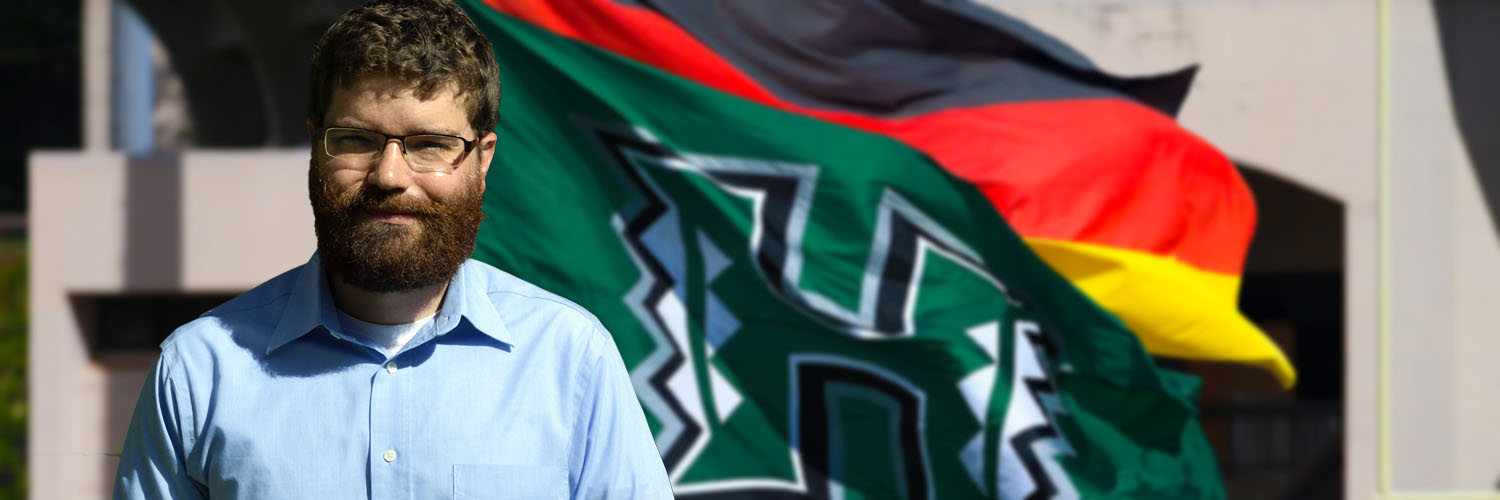 Prof. Uspal In Front Of UH And German Flags