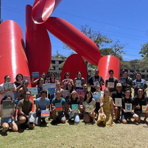 Group Photo Of Students In Front Of Gate Of Hope Sculpture