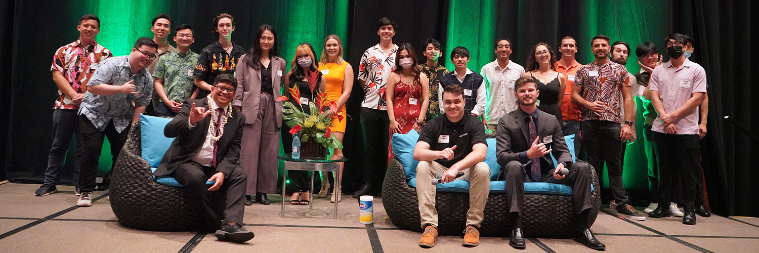 A Large Group Of Engineering Students Posing For A Photo On Stage