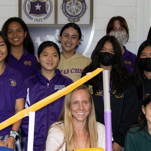 A Group Of Damien Students Posing For The Camera