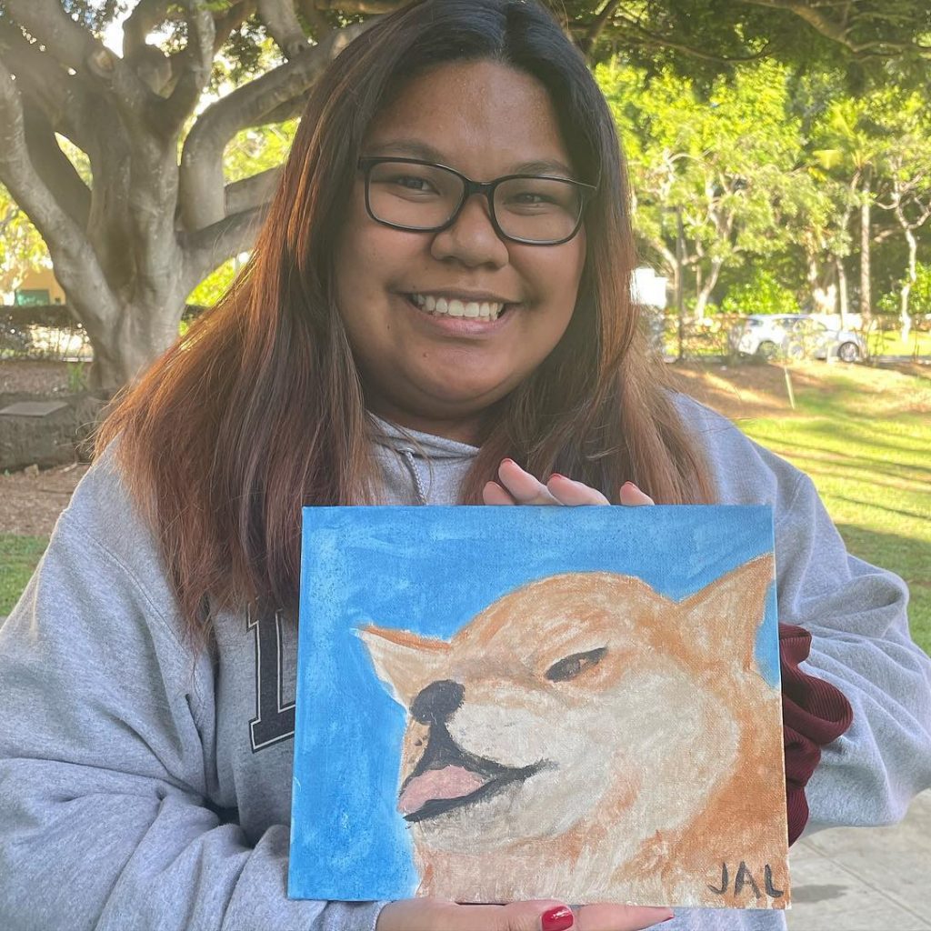 Woman Posing With Painting Of A Dog