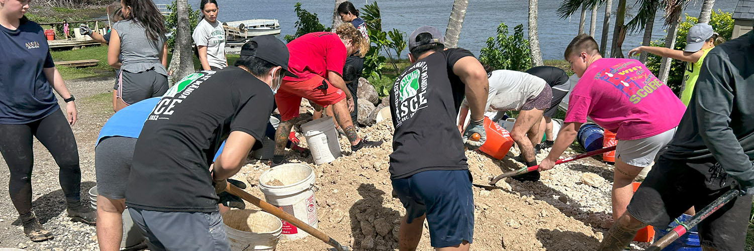 Civil Engineering Students Shoveling Gravel