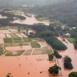 An overhead view of Hanalei Valley flooded with muddy water